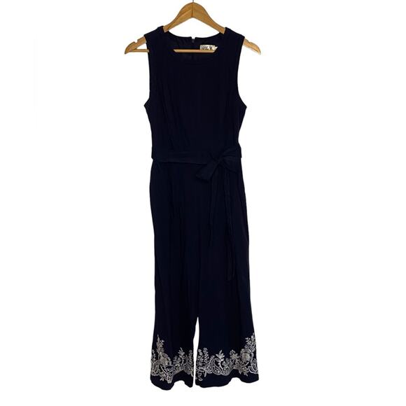 Eliza J Sleeveless Navy Jumpsuit  with Ladder Trim and Embroidery on the Hem - Picture 1 of 8